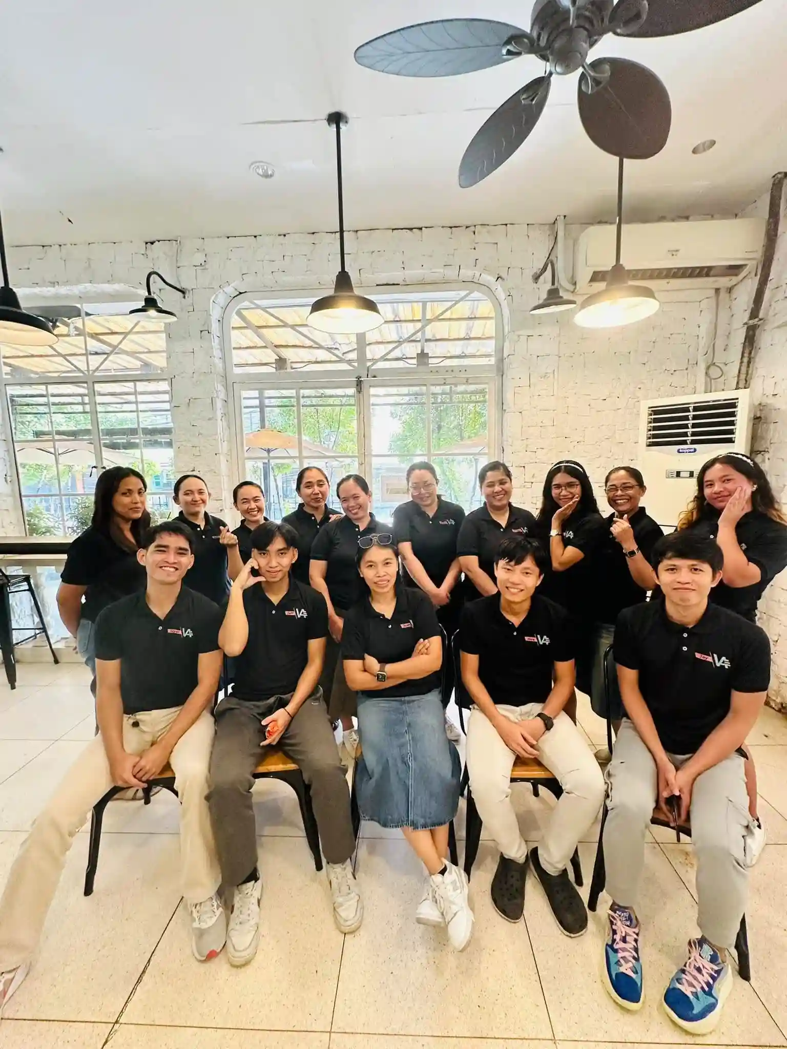 Virtually Assistant group picture wearing black t-shirts.